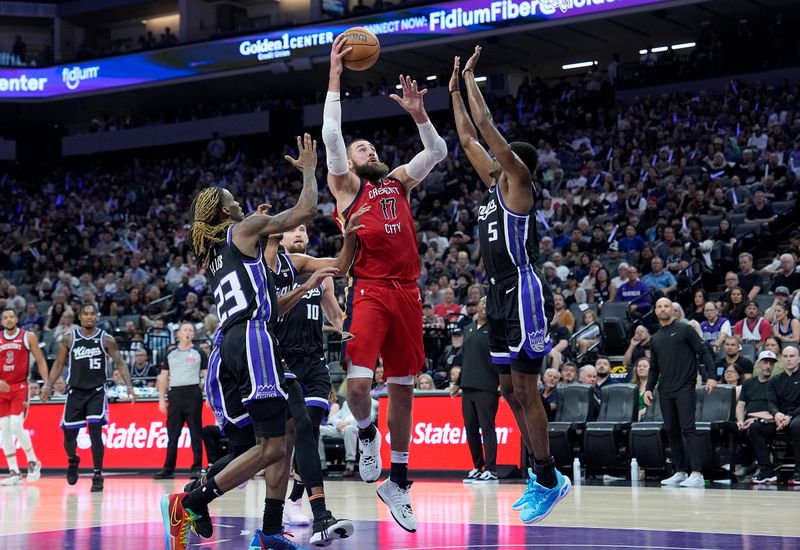 SACRAMENTO, CALIFORNIA - APRIL 11: Jonas Valanciunas #17 of the New Orleans Pelicans shoots over De'Aaron Fox #5 of the Sacramento Kings during the first half of an NBA basketball game at Golden 1 Center on April 11, 2024 in Sacramento, California. NOTE TO USER: User expressly acknowledges and agrees that, by downloading and or using this photograph, User is consenting to the terms and conditions of the Getty Images License Agreement. (Photo by Thearon W. Henderson/Getty Images)