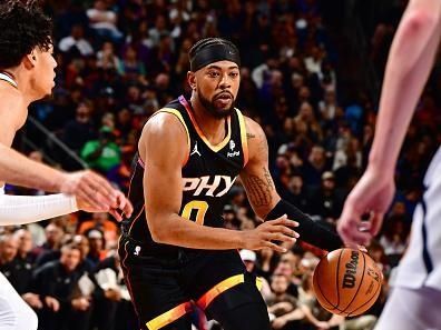 PHOENIX, AZ - DECEMBER 1: Jordan Goodwin #0 of the Phoenix Suns dribbles the ball during the game against the Denver Nuggets on December 1, 2023 at Footprint Center in Phoenix, Arizona. NOTE TO USER: User expressly acknowledges and agrees that, by downloading and or using this photograph, user is consenting to the terms and conditions of the Getty Images License Agreement. Mandatory Copyright Notice: Copyright 2023 NBAE (Photo by Barry Gossage/NBAE via Getty Images)