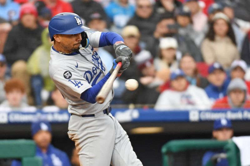 Apr 6, 2025; Philadelphia, Pennsylvania, USA; Los Angeles Dodgers shortstop Mookie Betts (50) hits a RBI double during the seventh inning against the Philadelphia Phillies at Citizens Bank Park. Mandatory Credit: Eric Hartline-Imagn Images