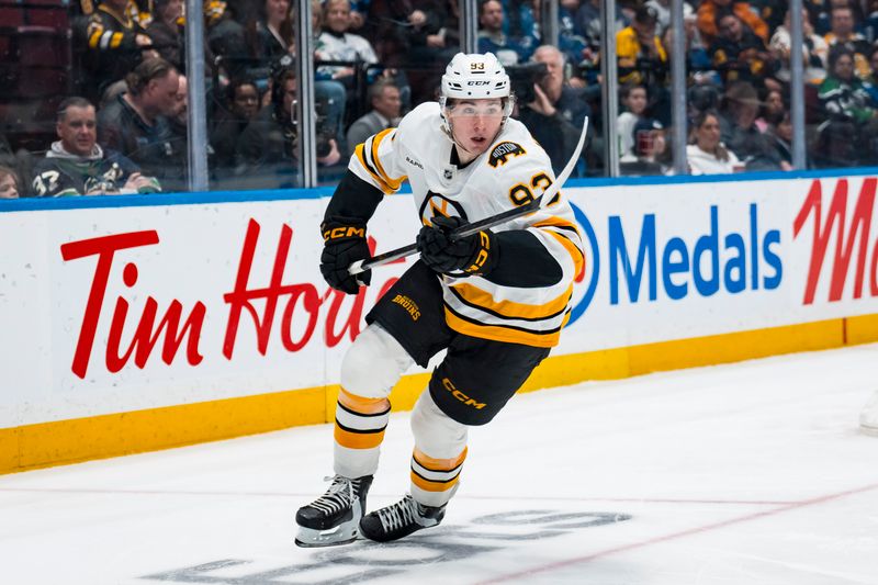 Jan 3, 2026; Vancouver, British Columbia, CAN; Boston Bruins forward Fraser Minten (93) skates against the Vancouver Canucks in the third period at Rogers Arena. Mandatory Credit: Bob Frid-Imagn Images