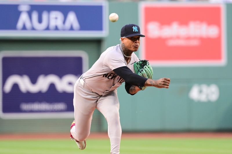 Jun 16, 2024; Boston, Massachusetts, USA; New York Yankees starting pitcher Marcus Stroman (0) pitches against the Boston Red Sox during the first inning at Fenway Park. Mandatory Credit: Eric Canha-USA TODAY Sports