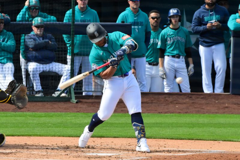 Feb 20, 2026; Peoria, Arizona, USA; Seattle Mariners shortstop Michael Arroyo (96) hits a two run home run in the second inning against the San Diego Padres during a Spring Training game at Peoria Sports Complex. Mandatory Credit: Matt Kartozian-Imagn Images