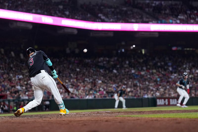 Jun 15, 2024; Phoenix, Arizona, USA; Arizona Diamondbacks designated hitter Joc Pederson (3) hits a sacrifice fly RBI against the Chicago White Sox during the fifth inning at Chase Field. Mandatory Credit: Joe Camporeale-USA TODAY Sports