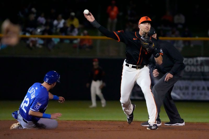 Mar 19, 2024; Scottsdale, Arizona, USA; San Francisco Giants shortstop Nick Ahmed (40) gets the force out on Kansas City Royals shortstop Nick Loftin (12) in the first inning at Scottsdale Stadium. Mandatory Credit: Rick Scuteri-USA TODAY Sports