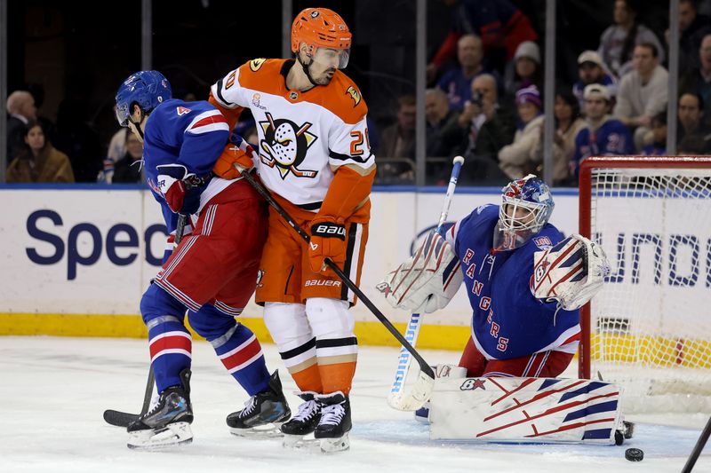 Dec 15, 2025; New York, New York, USA; Anaheim Ducks left wing Chris Kreider (20) plays the puck against New York Rangers defenseman Braden Schneider (4) and goaltender Igor Shesterkin (31) during the second period at Madison Square Garden. Mandatory Credit: Brad Penner-Imagn Images