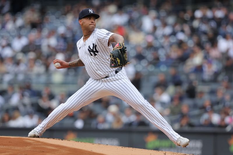 Apr 21, 2024; Bronx, New York, USA; New York Yankees starting pitcher Luis Gil (81) pitches against the Tampa Bay Rays during the first inning at Yankee Stadium. Mandatory Credit: Brad Penner-USA TODAY Sports