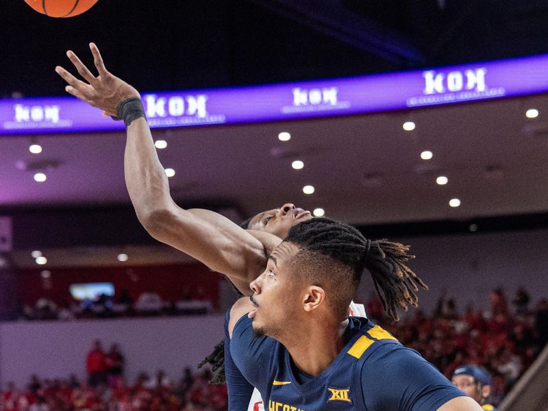 Jan 6, 2024; Houston, Texas, USA; Houston Cougars forward Joseph Tugler (25) shoots against West Virginia Mountaineers forward Josiah Harris (22) in the second half at Fertitta Center. Mandatory Credit: Thomas Shea-USA TODAY Sports