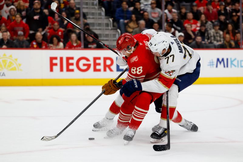Mar 6, 2026; Detroit, Michigan, USA;  Detroit Red Wings right wing Patrick Kane (88) skates with the puck defended by Florida Panthers defenseman Niko Mikkola (77) in the second period at Little Caesars Arena. Mandatory Credit: Rick Osentoski-Imagn Images