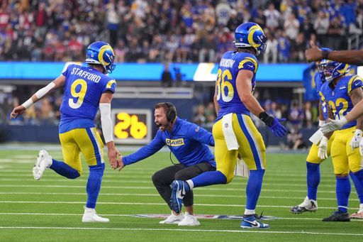 Los Angeles Rams head coach Sean McVay, center, reacts with quarterback Matthew Stafford (9) after a touchdown against the Buffalo Bills during the second half of an NFL football game, Sunday, Dec. 8, 2024, in Inglewood, Calif. (AP Photo/Eric Thayer)