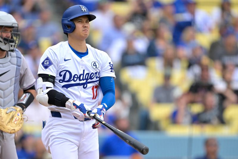 Jun 2, 2024; Los Angeles, California, USA;  Los Angeles Dodgers designated hitter Shohei Ohtani (17) reacts after fouling off a pitch in the fifth inning against the Colorado Rockies at Dodger Stadium. Mandatory Credit: Jayne Kamin-Oncea-USA TODAY Sports