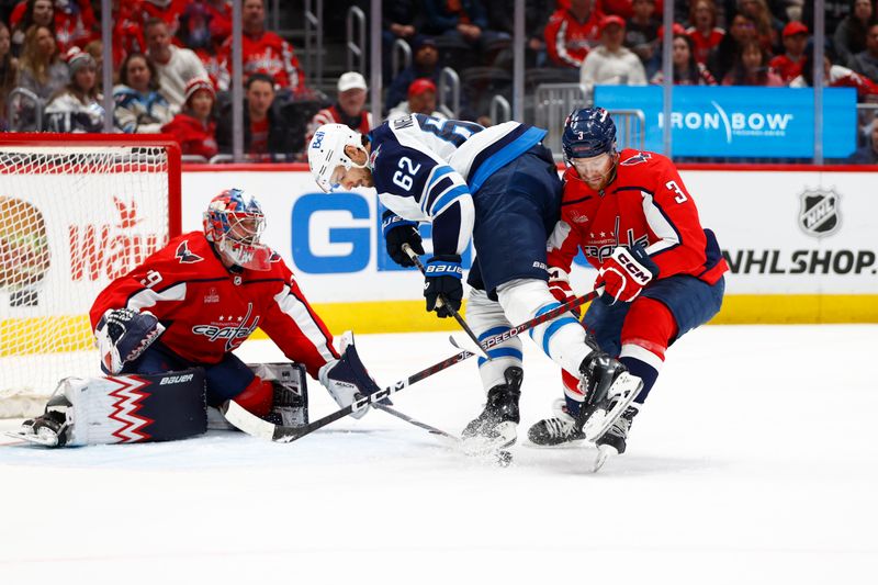 Mar 24, 2024; Washington, District of Columbia, USA; Washington Capitals defenseman Nick Jensen (3) battles for the puck with Winnipeg Jets right wing Nino Niederreiter (62) in front of Capitals goaltender Charlie Lindgren (79) during the second period at Capital One Arena. Mandatory Credit: Amber Searls-USA TODAY Sports