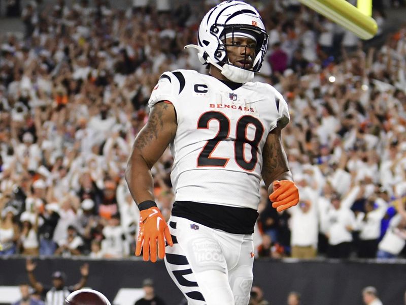 Cincinnati Bengals running back Joe Mixon (28) carries the ball for a touchdown during an NFL football game against the Los Angeles Rams on Monday, Sept. 25, 2023, in Cincinnati. (AP Photo/Emilee Chinn)