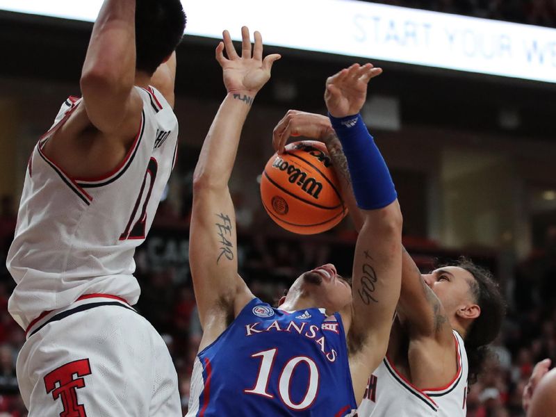 Jan 3, 2023; Lubbock, Texas, USA;  Texas Tech Red Raiders guard Jalen Tyson (20) blocks a shot by Kansas Jayhawks forward Jalen Wilson (10) in the second half at United Supermarkets Arena. Mandatory Credit: Michael C. Johnson-USA TODAY Sports