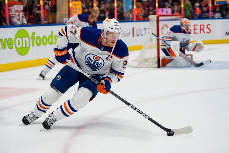 Nov 6, 2023; Vancouver, British Columbia, CAN; Edmonton Oilers forward Connor McDavid (97) handles the puck during warm up prior to a game against the Vancouver Canucks at Rogers Arena. Mandatory Credit: Bob Frid-USA TODAY Sports