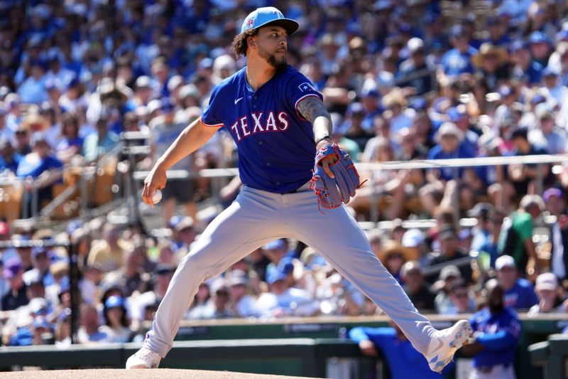 Mar 9, 2024; Phoenix, Arizona, USA; Texas Rangers starting pitcher Yerry Rodriguez (57) pitches against the Los Angeles Dodgers during the first inning at Camelback Ranch-Glendale. Mandatory Credit: Joe Camporeale-USA TODAY Sports