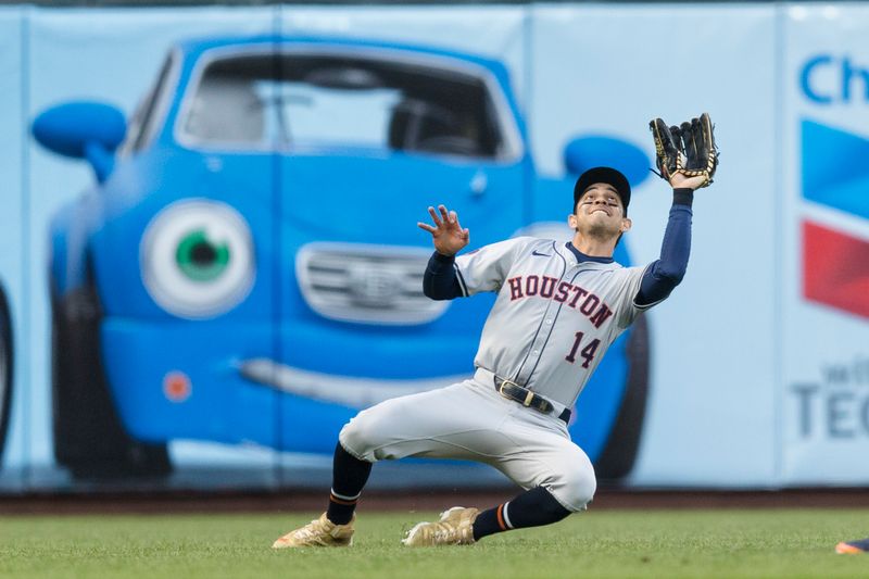 Jun 10, 2024; San Francisco, California, USA; Houston Astros left fielder Mauricio Dubón (14) catches a deep fly ball against the San Francisco Giants during the fourth inning at Oracle Park. Mandatory Credit: John Hefti-USA TODAY Sports