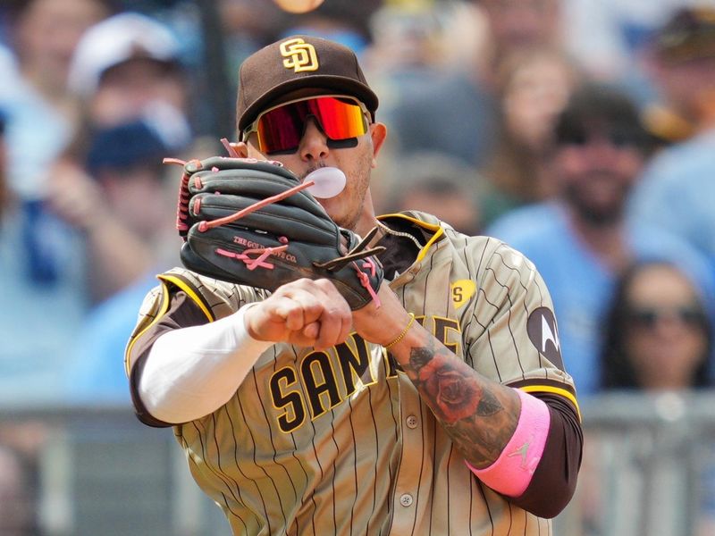 Jun 1, 2024; Kansas City, Missouri, USA; San Diego Padres third baseman Manny Machado (13) throws to first base against the Kansas City Royals during the fifth inning at Kauffman Stadium. Mandatory Credit: Jay Biggerstaff-USA TODAY Sports