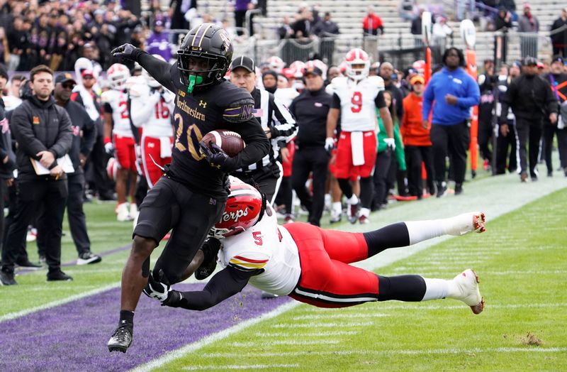 Oct 28, 2023; Evanston, Illinois, USA; Maryland Terrapins defensive lineman Quashon Fuller (5) runs Northwestern Wildcats running back Joseph Himon II (20) out of bounds during the second half at Ryan Field. Mandatory Credit: David Banks-USA TODAY Sports