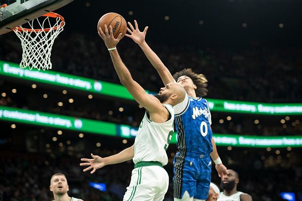 BOSTON, MASSACHUSETTS - DECEMBER 17: Derrick White #9 of the Boston Celtics drives to the basket during the second half against the Orlando Magic at TD Garden on December 17, 2023 in Boston, Massachusetts. NOTE TO USER: User expressly acknowledges and agrees that, by downloading and or using this photograph, user is consenting to the terms and conditions of the Getty Images License Agreement. (Photo by Maddie Malhotra/Getty Images)