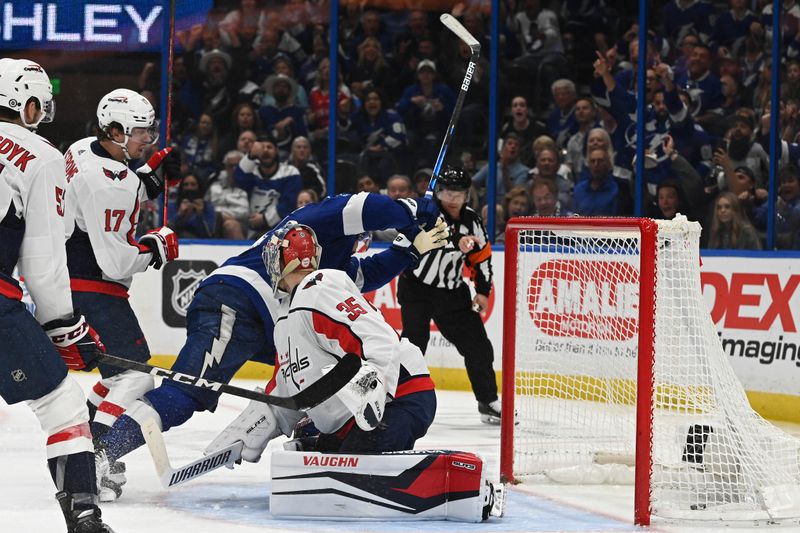 Mar 30, 2023; Tampa, Florida, USA; Tampa Bay Lightning left wing Pat Maroon (14) gets a shot past Washington Capitals goalie Darcy Kuemper (35) in the third period at Amalie Arena. Mandatory Credit: Jonathan Dyer-USA TODAY Sports