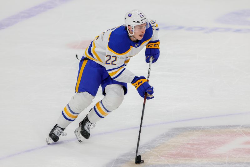 Apr 4, 2023; Sunrise, Florida, USA; Buffalo Sabres right wing Jack Quinn (22) moves the puck during the third period against the Florida Panthers at FLA Live Arena. Mandatory Credit: Sam Navarro-USA TODAY Sports