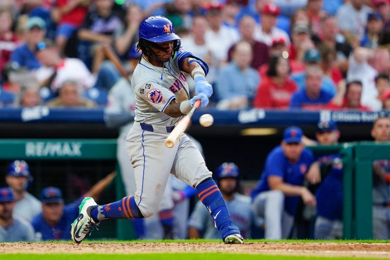 Sep 14, 2024; Philadelphia, Pennsylvania, USA; New York Mets shortstop Luisangel Acuna (2) hits a single against the Philadelphia Phillies during the ninth inning at Citizens Bank Park. Mandatory Credit: Gregory Fisher-Imagn Images