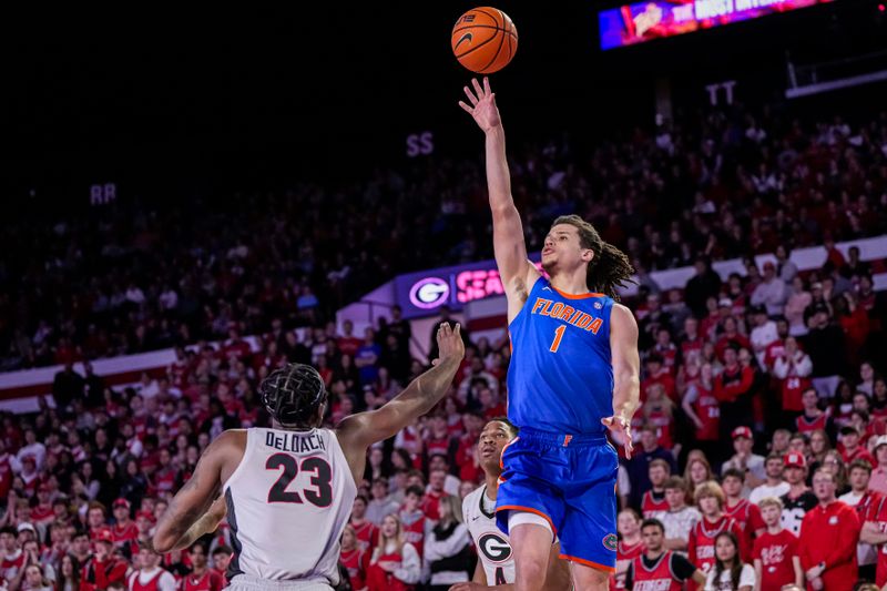 Feb 17, 2024; Athens, Georgia, USA; Florida Gators guard Walter Clayton Jr. (1) shoots over Georgia Bulldogs forward Jalen DeLoach (23) during the second half at Stegeman Coliseum. Mandatory Credit: Dale Zanine-USA TODAY Sports