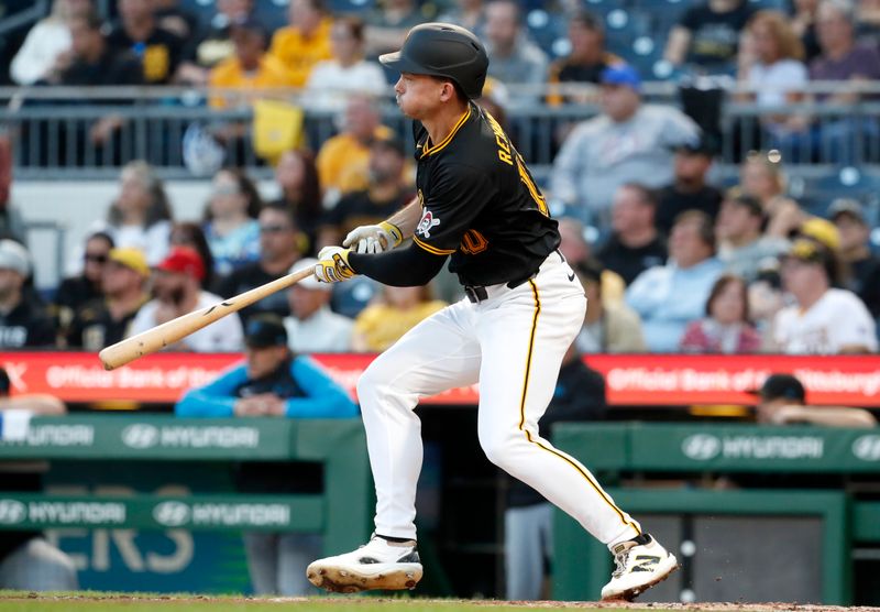 Sep 9, 2024; Pittsburgh, Pennsylvania, USA;  Pittsburgh Pirates left fielder Bryan Reynolds (10) hits a two-run single against the Miami Marlins during the second inning at PNC Park. Mandatory Credit: Charles LeClaire-Imagn Images
