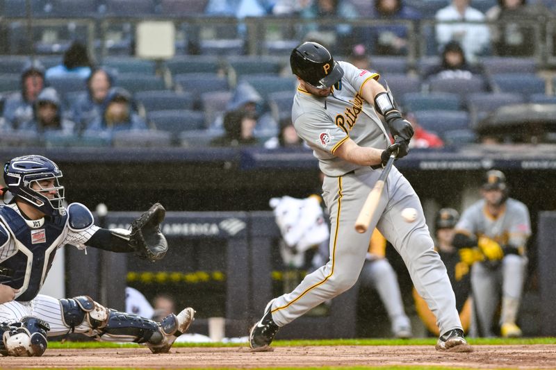 Sep 29, 2024; Bronx, New York, USA; Pittsburgh Pirates catcher Joey Bart (14) hits a single against the New York Yankees during the third inning at Yankee Stadium. Mandatory Credit: John Jones-Imagn Images