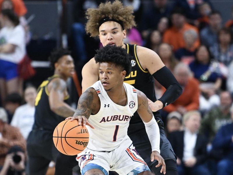 Feb 14, 2023; Auburn, Alabama, USA;  Auburn Tigers guard Wendell Green Jr. (1) drives past Missouri Tigers forward Noah Carter (35) during the first half at Neville Arena. Mandatory Credit: Julie Bennett-USA TODAY Sports