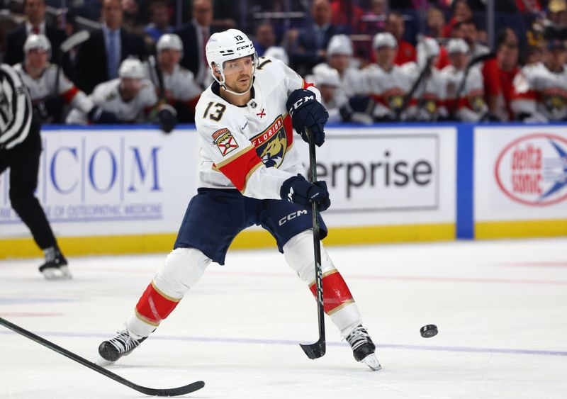 Oct 28, 2024; Buffalo, New York, USA;  Florida Panthers center Sam Reinhart (13) makes a pass during the third period against the Buffalo Sabres at KeyBank Center. Mandatory Credit: Timothy T. Ludwig-Imagn Images