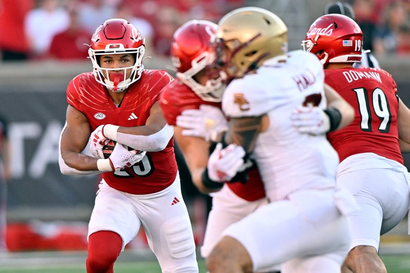 Sep 23, 2023; Louisville, Kentucky, USA;  Louisville Cardinals running back Isaac Guerendo (23) runs the ball against the Boston College Eagles during the second half at L&N Federal Credit Union Stadium. Louisville defeated Boston College 56-28. Mandatory Credit: Jamie Rhodes-USA TODAY Sports