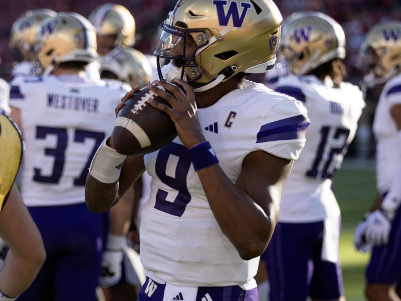 Oct 28, 2023; Stanford, California, USA; Washington Huskies quarterback Michael Penix Jr. (9) warms up on the sidelines during a timeout in the first quarter against the Stanford Cardinal at Stanford Stadium. Mandatory Credit: D. Ross Cameron-USA TODAY Sports