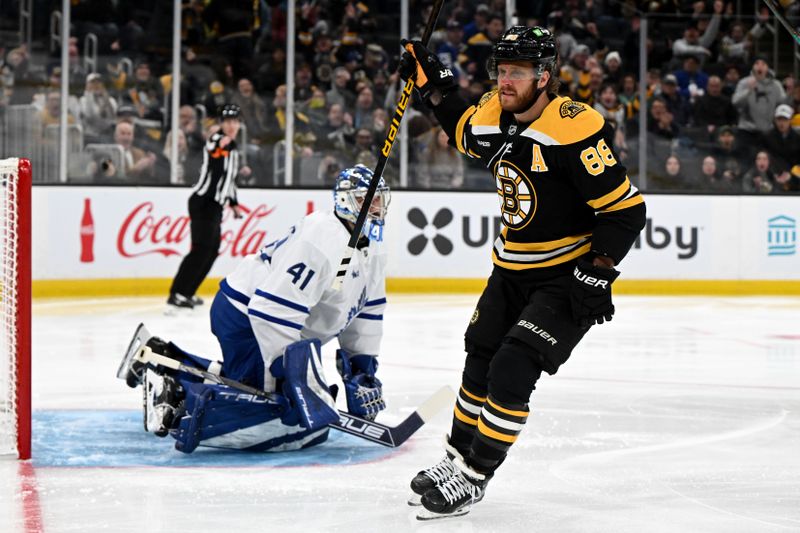 Feb 25, 2025; Boston, Massachusetts, USA;  Boston Bruins right wing David Pastrnak (88) celebrates after scoring a goal against the Toronto Maple Leafs during the first period at the TD Garden. Mandatory Credit: Brian Fluharty-Imagn Images