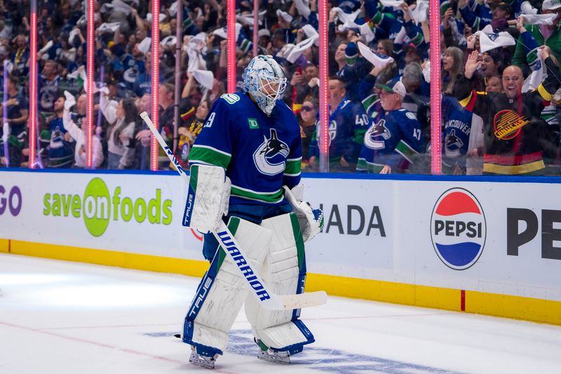 Apr 23, 2024; Vancouver, British Columbia, CAN; Vancouver Canucks goalie Casey DeSmith (29) skates while the fans celebrate a goal scored by defenseman Nikita Zadorov (not pictured) against the Nashville Predators during the second period in game two of the first round of the 2024 Stanley Cup Playoffs at Rogers Arena. Mandatory Credit: Bob Frid-USA TODAY Sports