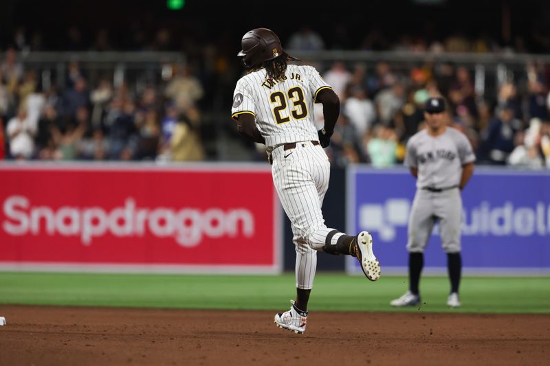 May 25, 2024; San Diego, California, USA; San Diego Padres right fielder Fernando Tatis Jr. (23) hits a solo home run in the eighth inning against the New York Yankees at Petco Park. Mandatory Credit: Chadd Cady-USA TODAY Sports