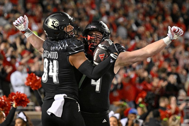 Nov 9, 2023; Louisville, Kentucky, USA; Louisville Cardinals tight end Joey Gatewood (84) celebrates touchdown with Louisville Cardinals offensive lineman Eric Miller (74) during the first quarter against the Virginia Cavaliers at L&N Federal Credit Union Stadium. Mandatory Credit: Jamie Rhodes-USA TODAY Sports