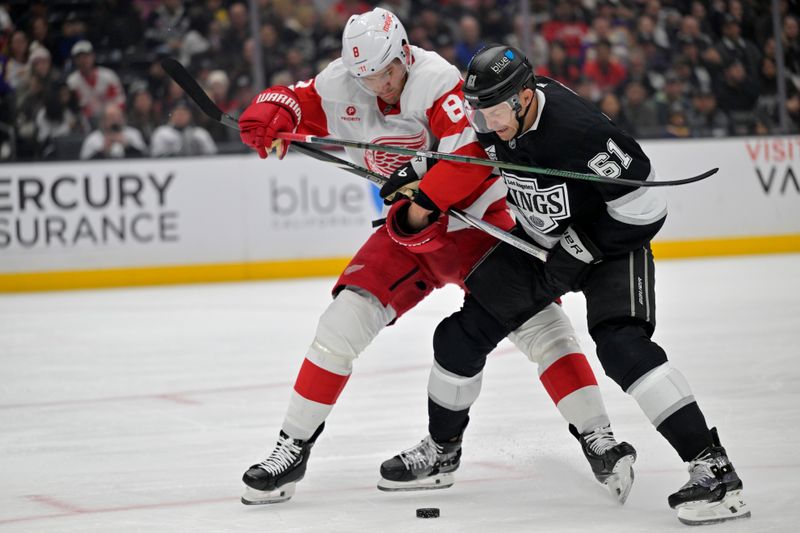 Nov 16, 2024; Los Angeles, California, USA; Detroit Red Wings defenseman Ben Chiarot (8) and Los Angeles Kings center Trevor Lewis (61) battle for the puck in the second period at Crypto.com Arena. Mandatory Credit: Jayne Kamin-Oncea-Imagn Images