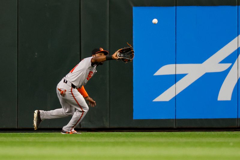 Jul 3, 2024; Seattle, Washington, USA; Baltimore Orioles center fielder Cedric Mullins (31) catches a line drive against the Seattle Mariners during the eighth inning at T-Mobile Park. Mandatory Credit: Joe Nicholson-USA TODAY Sports