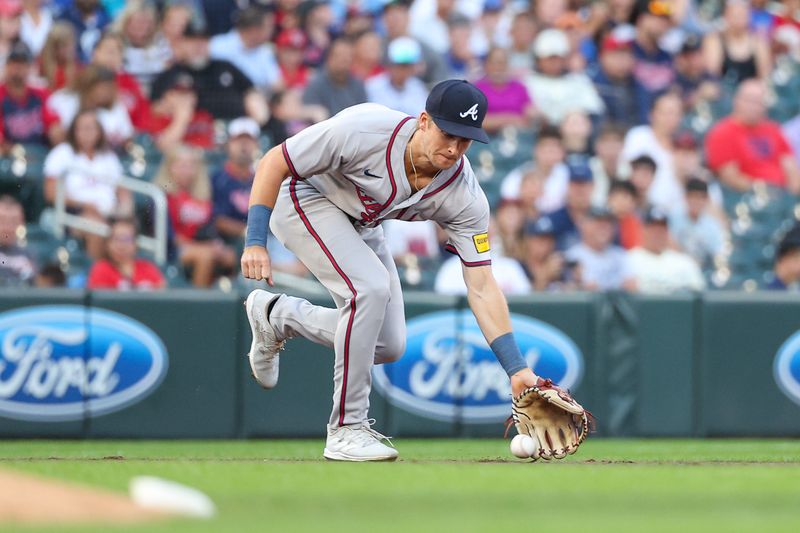 Aug 28, 2024; Minneapolis, Minnesota, USA; Atlanta Braves third baseman Luke Williams (65) fields the ball hit by Minnesota Twins first baseman Carlos Santana (30) during the second inning at Target Field. Mandatory Credit: Matt Krohn-USA TODAY Sports