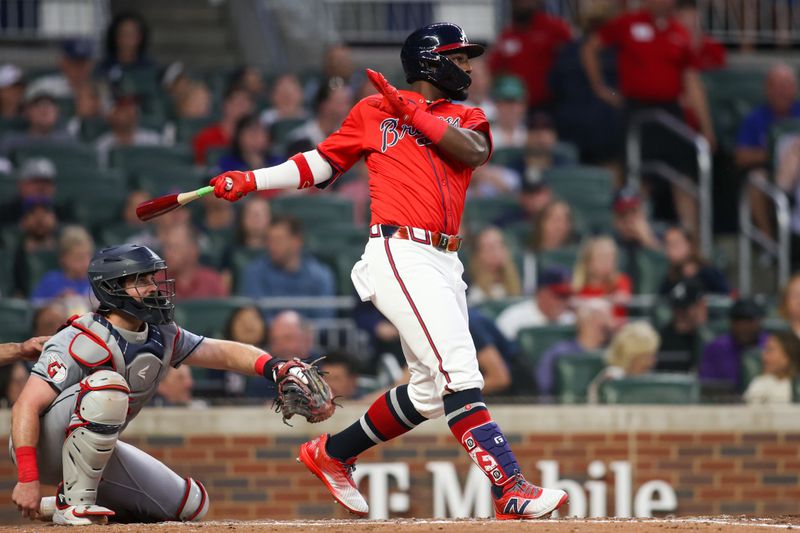 Apr 26, 2024; Atlanta, Georgia, USA; Atlanta Braves center fielder Michael Harris II (23) hits a RBI double against the Cleveland Guardians in the fourth inning at Truist Park. Mandatory Credit: Brett Davis-USA TODAY Sports