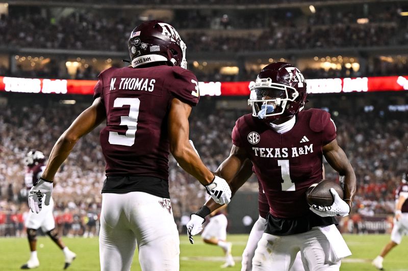 Sep 2, 2023; College Station, Texas, USA; Texas A&M Aggies wide receiver Evan Stewart (1) celebrates with teammate wide receiver Noah Thomas (3) after his touchdown during the third quarter New Mexico Lobos at Kyle Field. Mandatory Credit: Maria Lysaker-USA TODAY Sports