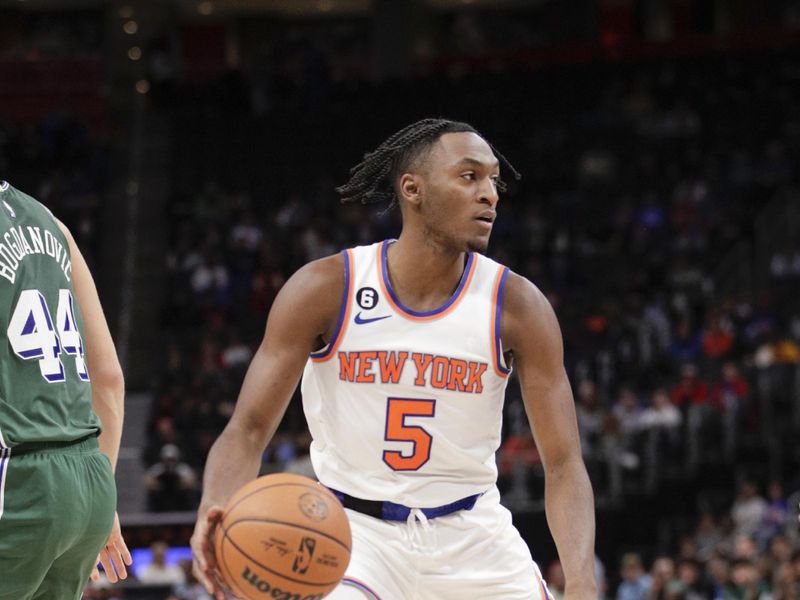 DETROIT, MI - NOVEMBER 29:  Immanuel Quickley #5 of the New York Knicks handles the ball during the game against the Detroit Pistons on November 29, 2022 at Little Caesars Arena in Detroit, Michigan. NOTE TO USER: User expressly acknowledges and agrees that, by downloading and/or using this photograph, User is consenting to the terms and conditions of the Getty Images License Agreement. Mandatory Copyright Notice: Copyright 2022 NBAE (Photo by Brian Sevald/NBAE via Getty Images)