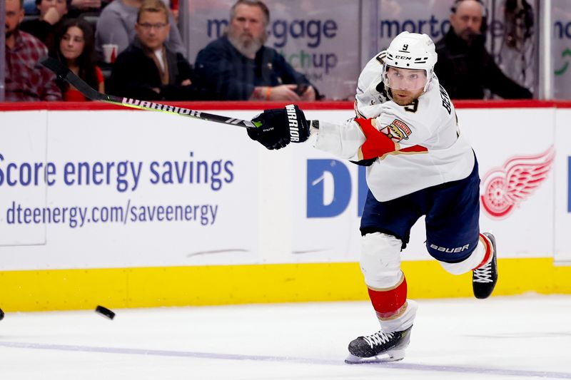 Mar 2, 2024; Detroit, Michigan, USA; Florida Panthers center Sam Bennett (9) takes a shot in the third period against the Detroit Red Wings at Little Caesars Arena. Mandatory Credit: Rick Osentoski-USA TODAY Sports