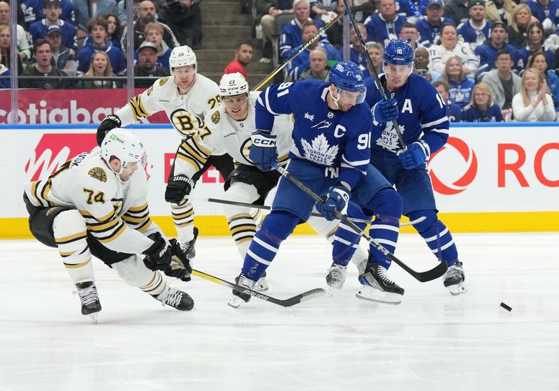 Apr 27, 2024; Toronto, Ontario, CAN; Toronto Maple Leafs center John Tavares (91) battles for the puck with Boston Bruins left wing Jake DeBrusk (74) during the first period in game four of the first round of the 2024 Stanley Cup Playoffs at Scotiabank Arena. Mandatory Credit: Nick Turchiaro-USA TODAY SportsMandatory Credit: Nick Turchiaro-USA TODAY Sports