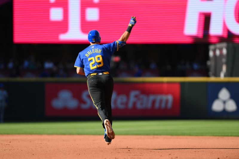 Aug 11, 2024; Seattle, Washington, USA; Seattle Mariners catcher Cal Raleigh (29) runs the bases after hitting a 2-run home run against the New York Mets during the fifth inning at T-Mobile Park. Mandatory Credit: Steven Bisig-USA TODAY Sports