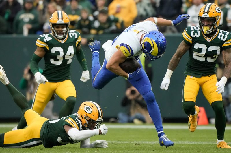 Los Angeles Rams wide receiver Cooper Kupp (10) runs with the football after catching a pass during the first half of an NFL football game against the Green Bay Packers, Sunday, Nov. 5, 2023, in Green Bay, Wis. (AP Photo/Morry Gash)