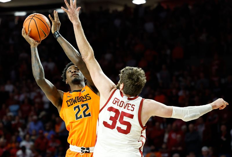 Feb 1, 2023; Norman, Oklahoma, USA; Oklahoma State Cowboys forward Kalib Boone (22) shoots as Oklahoma Sooners forward Tanner Groves (35) defends during the first half at Lloyd Noble Center. Mandatory Credit: Alonzo Adams-USA TODAY Sports