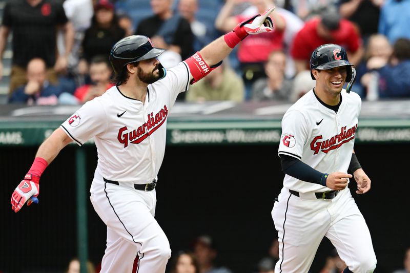 May 4, 2024; Cleveland, Ohio, USA; Cleveland Guardians catcher Austin Hedges, left,  and center fielder Tyler Freeman (2) celebrate after Hedges hit a home run during the second inning against the Los Angeles Angels at Progressive Field. Mandatory Credit: Ken Blaze-USA TODAY Sports