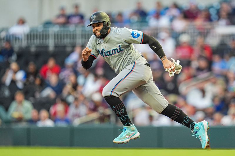 Apr 23, 2024; Cumberland, Georgia, USA; Miami Marlins first baseman Emmanuel Rivera (15) runs the bases against the Atlanta Braves during the third inning at Truist Park. Mandatory Credit: Dale Zanine-USA TODAY Sports